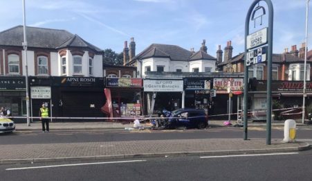 Man fighting for his life after car crashes into shop front in